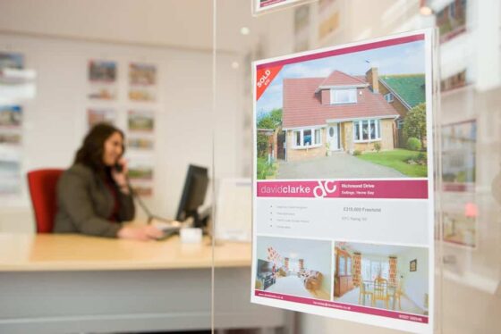 David Clarke Estate Agents office with property listing display